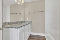 Full bath w/granite-topped vanity w/storage