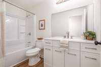 Hall bath has been beautifully renovated with New Tub/Shower, New Vanity, New Toilet, New Lighting and Flooring!