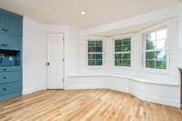 Bay window with triple windows brings the outside in