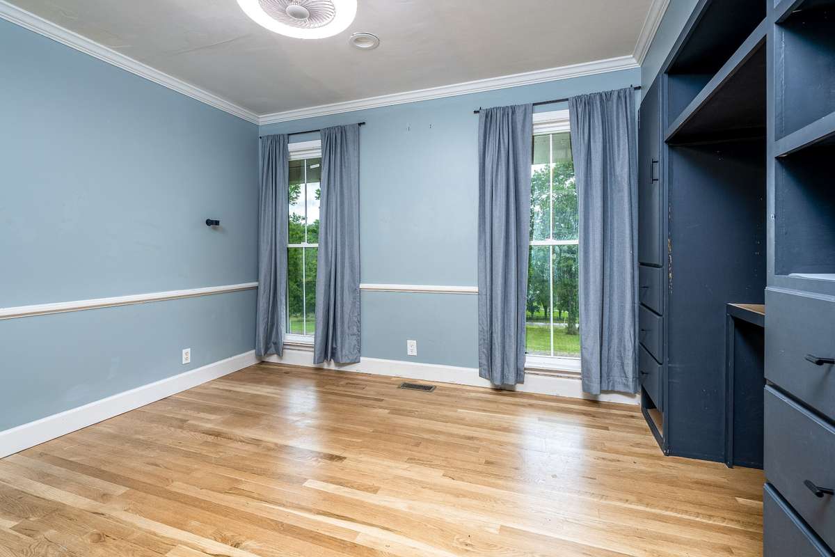 Secondary Bedroom downstairs with built in cabinets