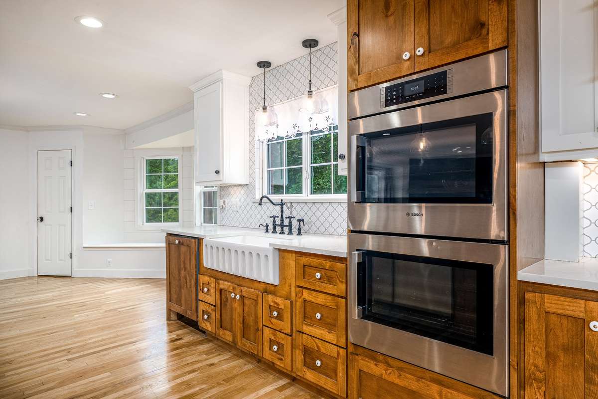 Stainless Steel Double Oven, Farm Sink and Plenty of natural light wihile overlooking the surrounding rolling hills