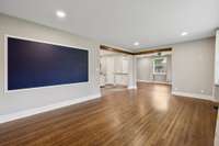 Spacious living room that flows into dining room and kitchen.