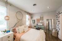 Secondary bedroom with shared bath and walk in closet
