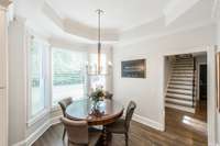 The kitchen dining nook is tucked away with plenty of room and beautiful views.