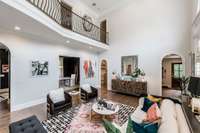 The second floor hall is open to the living room