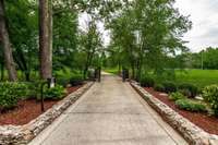 Private, gated entrance crossing the creek on entry.