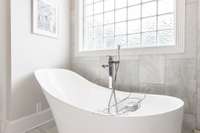 Soaking slipper tub with freestanding faucet