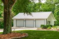 The detached garage, built in 2019 has 3 doors but is extra deep. This garage has power and another large back porch.