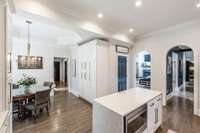 Cabinet hardware is honey throughout the kitchen.
