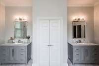 Separate vanities, marble tops, and marble floors