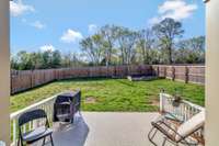 Amazing Backyard with Large Covered Patio Area, An Open Patio Area, Raised Garden Bed, and Nice Green Space!