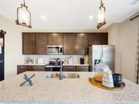 This is a photo of one of our model homes. Please know that some of the exterior and interior finishes, paint, and features may vary.