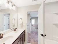This is a photo of one of our model homes. Please know that some of the exterior and interior finishes, paint, and features may vary.