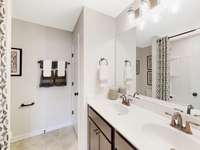 This is a photo of one of our model homes. Please know that some of the exterior and interior finishes, paint, and features may vary.