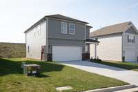 This is a photo of one of our model homes. Please know that some of the exterior and interior finishes, paint, and features may vary.