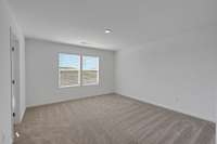 This is a photo of one of our model homes. Please know that some of the exterior and interior finishes, paint, and features may vary.