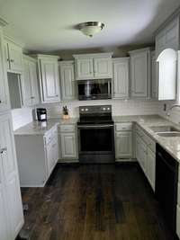 Nice eat in kitchen with custom cabinets.