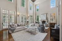 Ton of beautiful windows and natural light in this family room space-