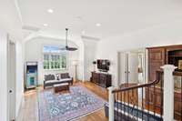 Recreation room with full ensuite bedroom to the left, and bathroom, bonus room to the right