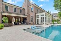 Custom pool built by Rondo pools with a swim out ledge and loungers
