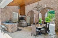 More entertainment space, with summer kitchen equipped with all of the amenities!