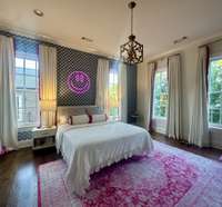 Precious teen girl ensuite with hardwood floors, custom draperies, decorators lighting and wall paper. Full ensuite including bathroom-4th bedroom