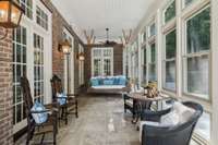 Screened porch with built in hanging swing