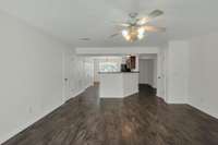 A view from the den back toward the kitchen and the foyer