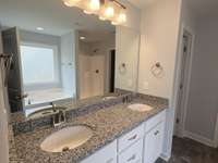 Photo of different home but same floor plan. Finishes will vary.