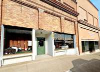 Springfield Guitar Company.  A full service music store that offers lessons for nearly every string instrument you can think of and more!  Located on the east side of the square.