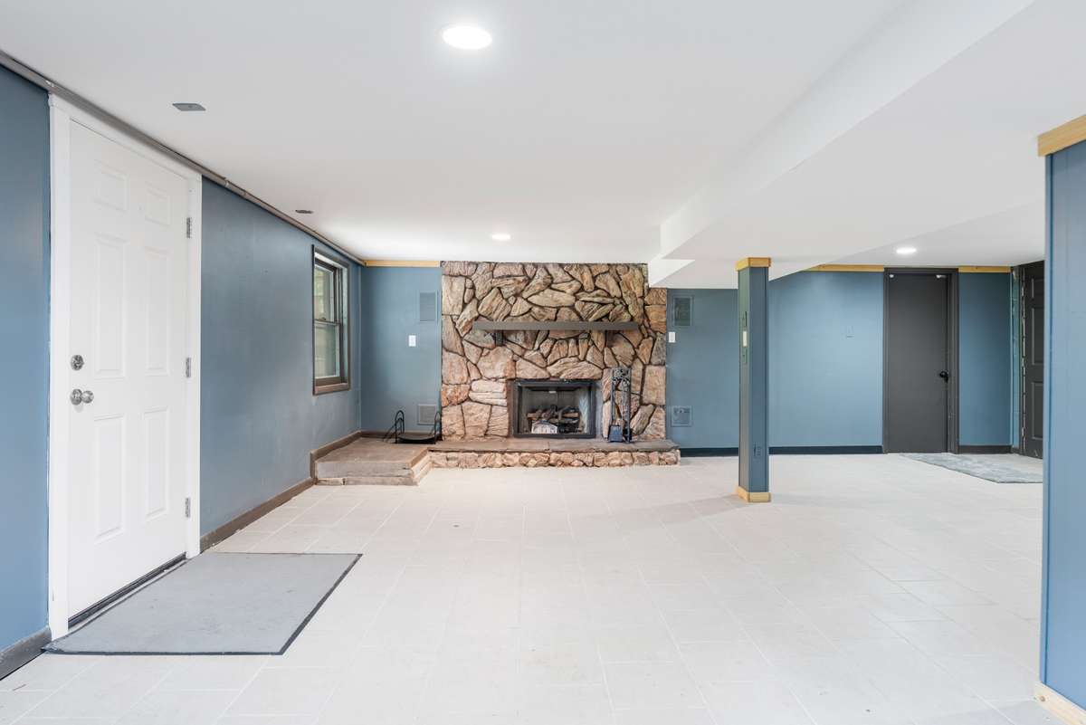 Finished basement with gas fireplace.