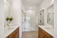 Dual bowl vanity's and walk in shower with frameless glass door- what more could you ask for.  *Model home photos for representation, actual features and finishes may vary.