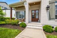 Savor peaceful morning coffees on this tranquil street from the comfort of your covered front porch