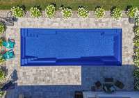 Step outside to your private retreat featuring a brand new 40’ heated saltwater pool, a screened-in 30’ porch with gas fireplace, and lush irrigated lawn.