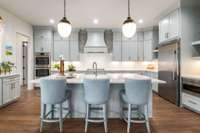 The kitchen is outfitted with premium Electrolux appliances throughout, combining sleek design with top-tier performance.
