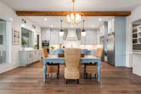 A secondary dining area adjacent to the kitchen enhances the open-concept layout, offering a casual space for everyday meals, while the formal dining room provides an elegant setting for special occasions.