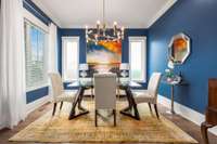 Just off the stunning entryway, you'll find a versatile study or bedroom currently used as a formal dining space.