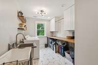 Laundry Room off of Primary Bathroom with clothes shute