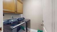 The utility room is accompanied by tile flooring & built in cabinets - perfect for housing your supplies. 532 Johnstown Dr. Smyrna, TN 37167