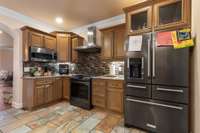 Your kitchen is accompanied with granite countertops, tile backsplash, crown molding, tile flooring & SS appliances including a built in microwave & gas oven. 532 Johnstown Dr. Smyrna, TN 37167