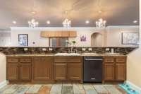 Another view of your kitchen with an oversized island lit by three chandeliers, perfect for hosting & entertaining. 532 Johnstown Dr. Smyrna, TN 37167