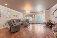 Living room with formal chandelier, crown molding & double window. 532 Johnstown Dr. Smyrna, TN 37167