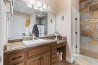The primary bathroom has an oversized single vanity with granite countertops & tile flooring. 532 Johnstown Dr. Smyrna, TN 37167