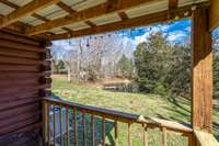 Rock or Swing on your front porch while watching your children fish from the pond