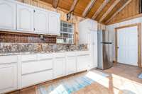Plenty of Cabinets for storage - Tiled Flooring - Stainless Steel Refrigerator is included