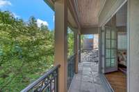 The balcony provides a back yard view.