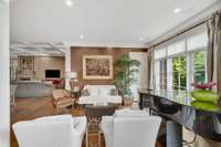 The formal living is open and provides a flexible floor plan with elegant millwork throughout the home.