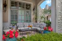 The covered front porch is perfect shady spot for your morning coffee.