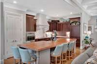 The 13' island with a 3" walnut countertop will accommodate comfortable seating for seven.