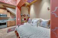 The sleeping/reading bedroom niche accommodates a queen size bed.